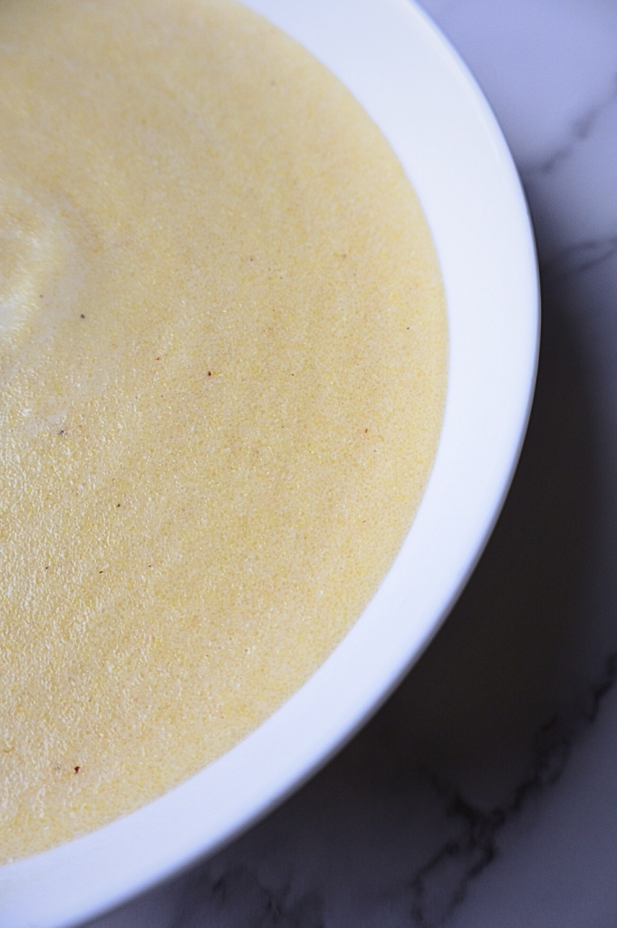 Creamy cooked farina hot cereal in a white bowl
