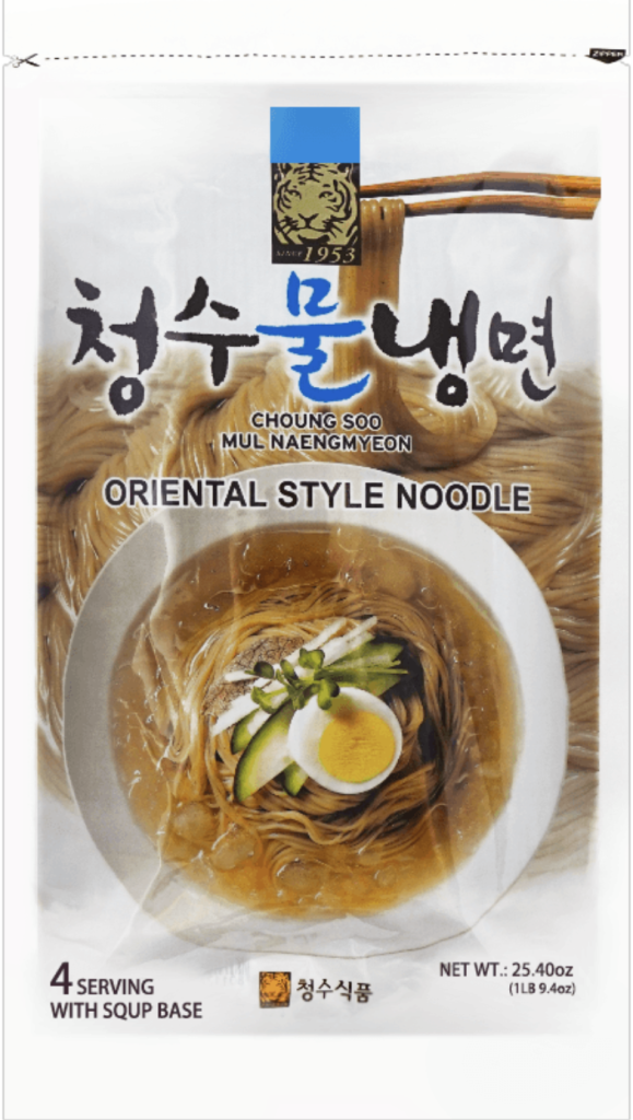Package of uncooked naengmyeon noodles, traditional Korean buckwheat noodles used to make cold noodle dishes such as mul naengmyeon and bibim naengmyeon.