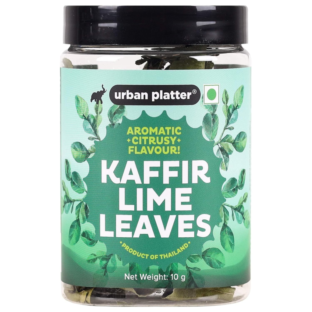 Jar of dried kaffir lime leaves, an aromatic ingredient used in Thai curries, soups, stir-fries, and Southeast Asian cuisine.
