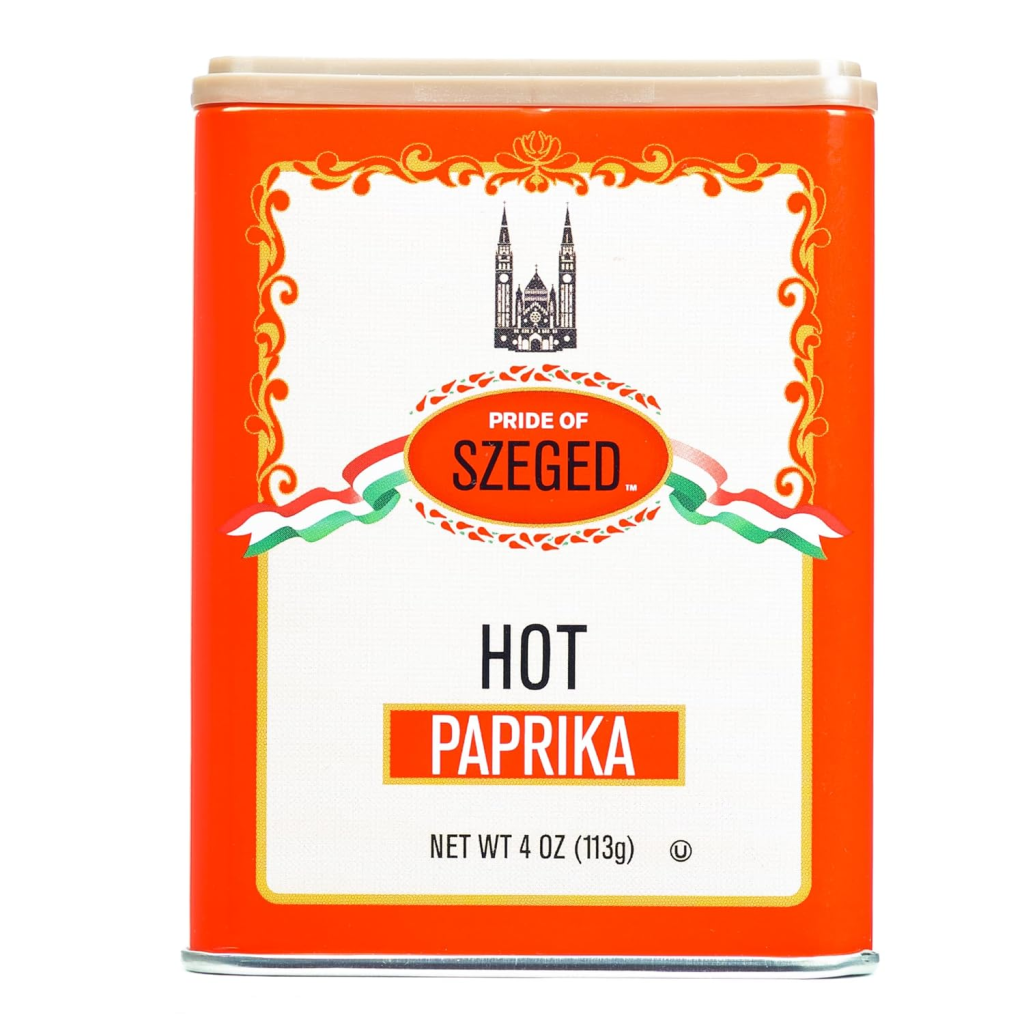 Tin of Hungarian hot paprika, a vibrant ground red pepper spice used to add color, warmth, and flavor to soups, stews, meats, and vegetables.
