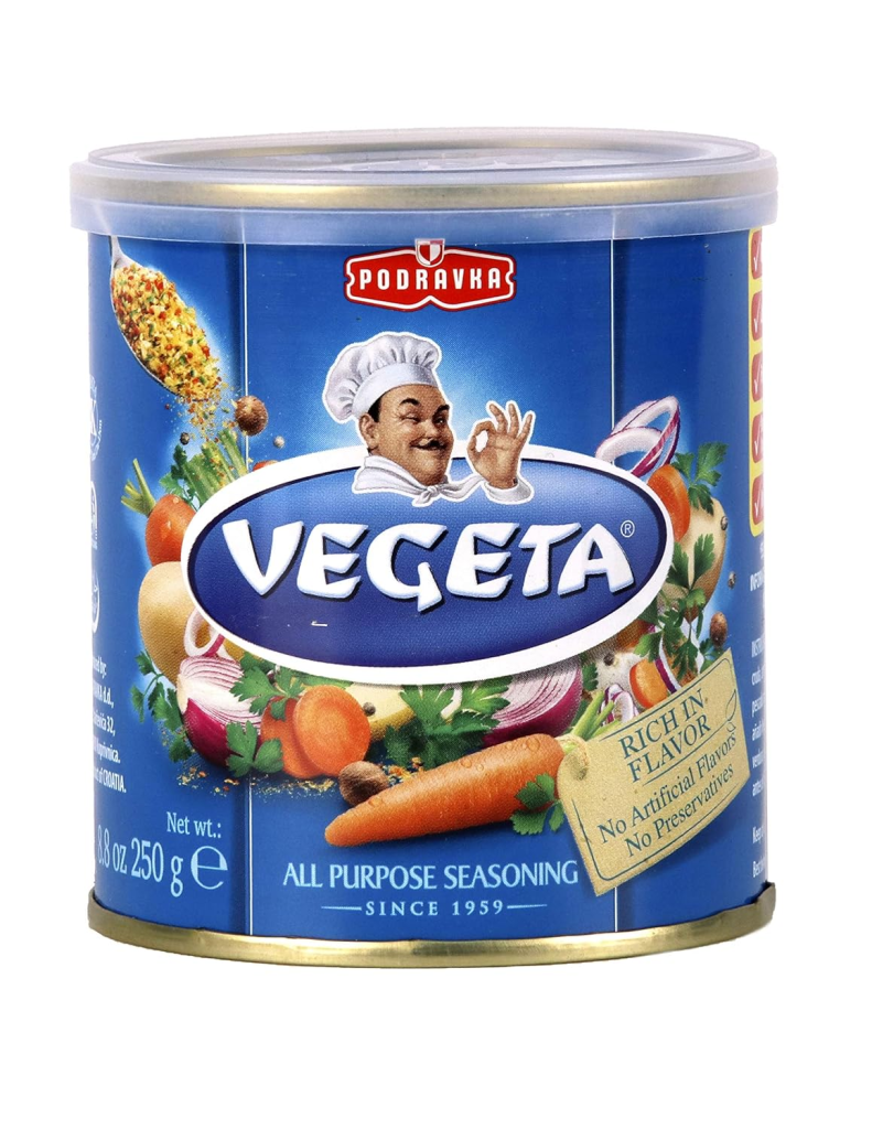 Container of Vegeta all-purpose seasoning, a popular Croatian vegetable seasoning blend used to enhance soups, stews, meats, rice, and vegetables.