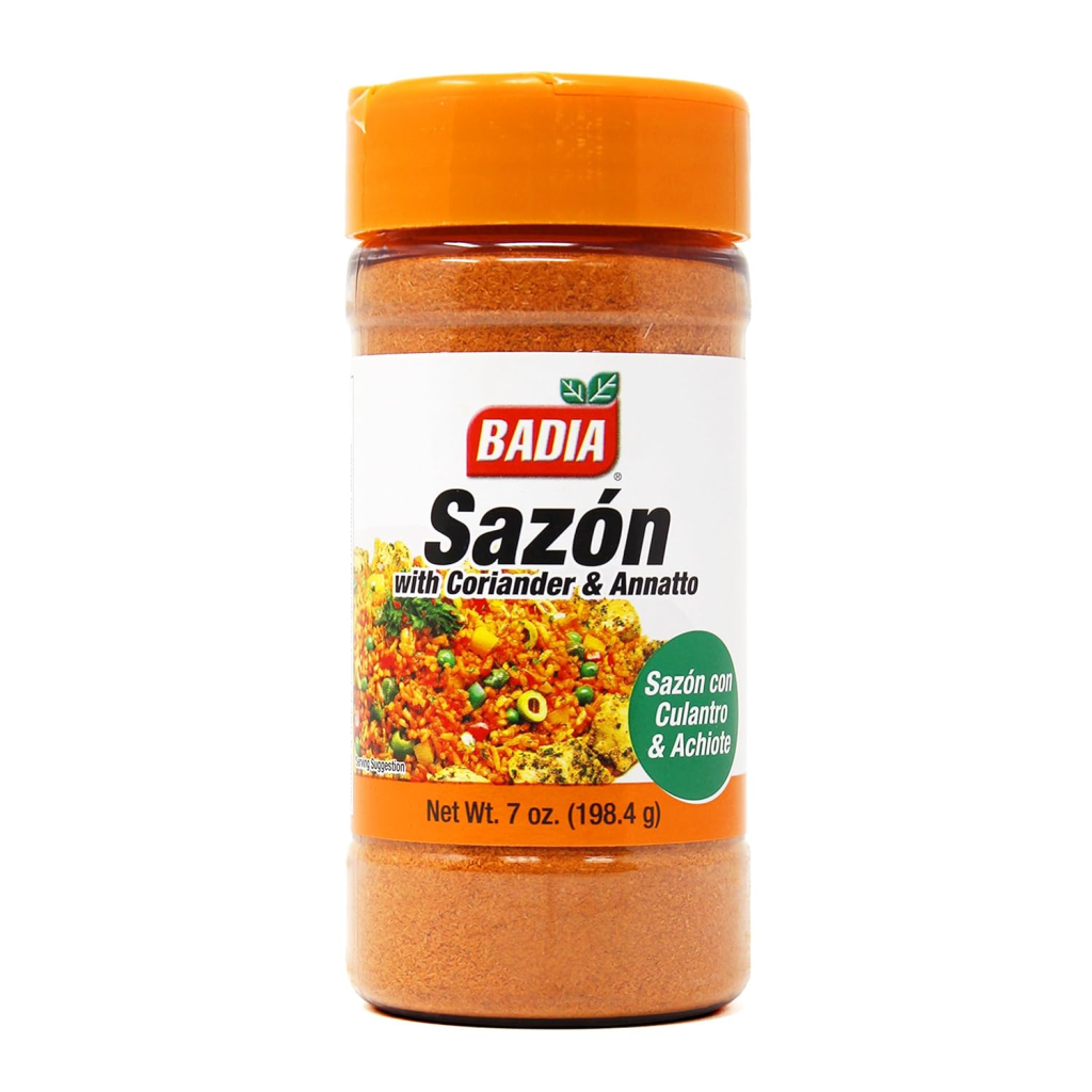 Container of Badia Sazón with Coriander and Annatto seasoning, a Latin all-purpose spice blend used to season rice, beans, meats, soups, and stews.