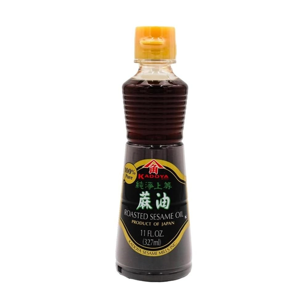 Bottle of roasted sesame oil, a fragrant cooking oil commonly used in Korean, Chinese, and Japanese recipes for rich, nutty flavor.
