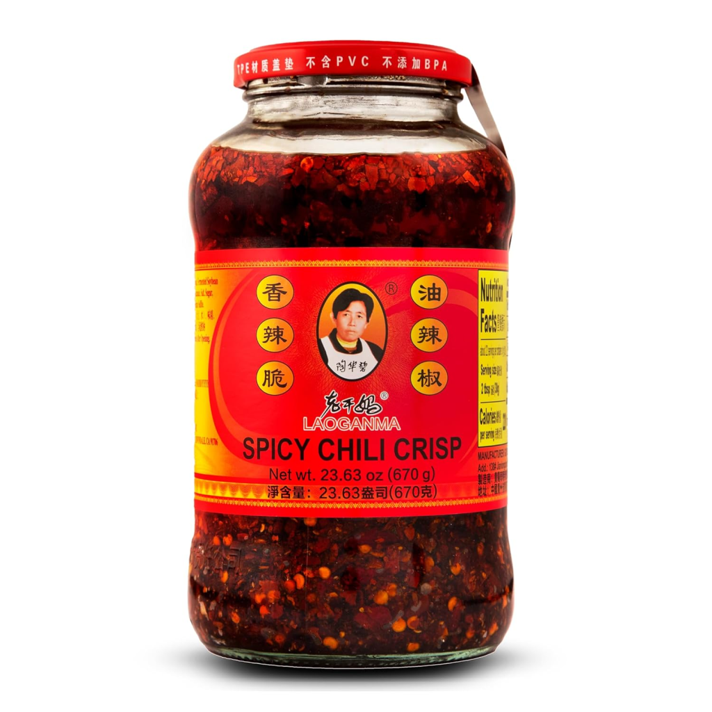 Jar of Lao Gan Ma Spicy Chili Crisp, a crunchy chili oil condiment made with chili peppers, fried aromatics, and oil.