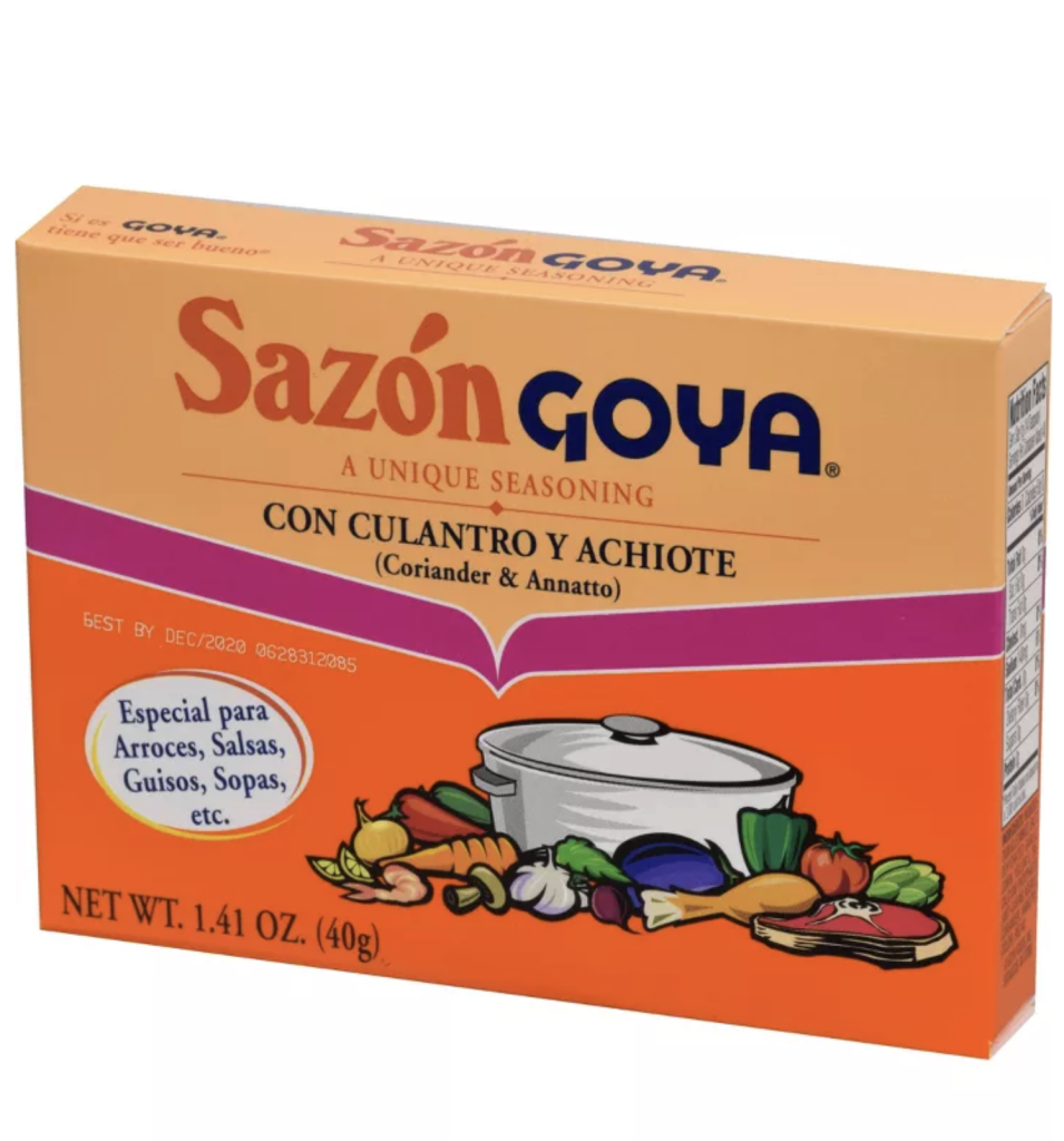 Sazon Goya con Culantro y Achiote seasoning packet box, the key ingredient that gives tomato paella its rich orange color