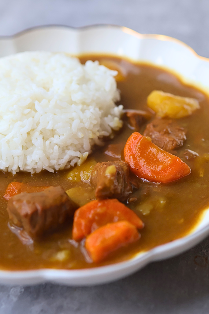 Traditional Japanese kare raisu with tender beef, carrots, potatoes, rich curry sauce, and steamed white rice.
