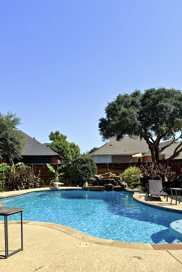 Backyard swimming pool decorated for an American summer pool party during the Hosting the World USA celebration.