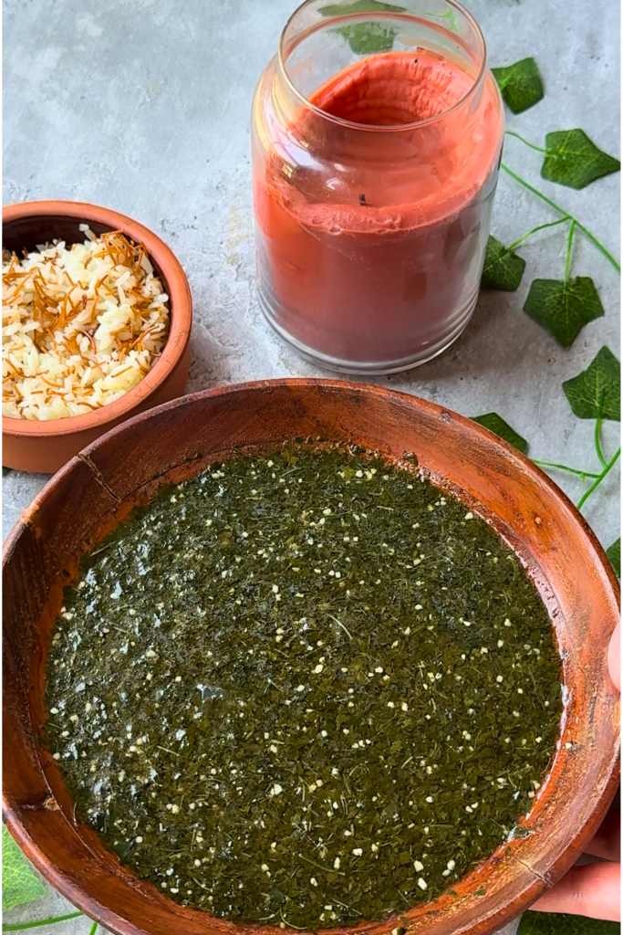Traditional Egyptian molokhia made with finely chopped jute leaves, served with white rice and toasted vermicelli, alongside Egyptian hibiscus tea.