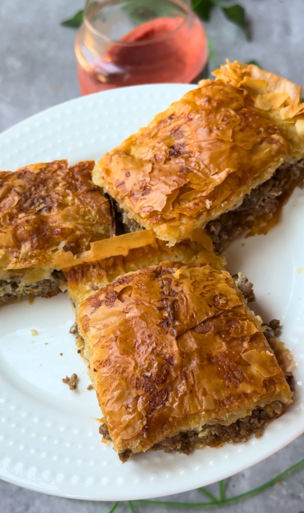 Traditional Egyptian goulash made with layers of flaky phyllo pastry filled with seasoned ground beef and baked until golden brown.