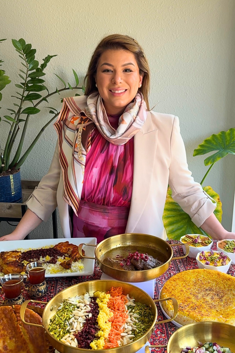 Emilia Kim hosting an Iranian dinner table featuring traditional Persian dishes for her Hosting the World series.