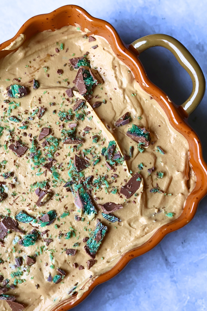 South African peppermint crisp tart topped with crushed chocolate and peppermint pieces