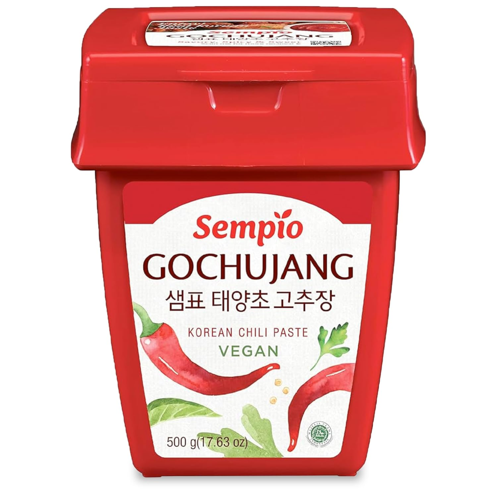 Sempio gochujang Korean chili paste in a red container, a fermented condiment used in Korean dishes like bibimbap, marinades, and stews.