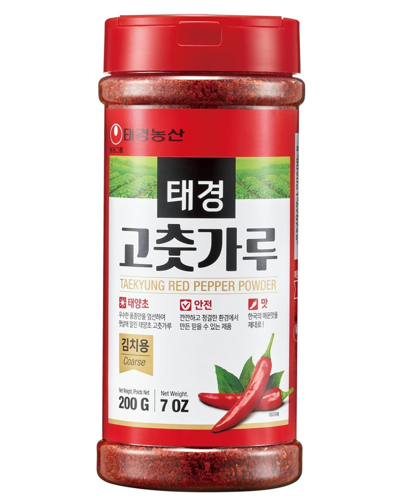 Taekyung gochugaru Korean red pepper powder in a jar, a key ingredient used to make kimchi and Korean spicy dishes.