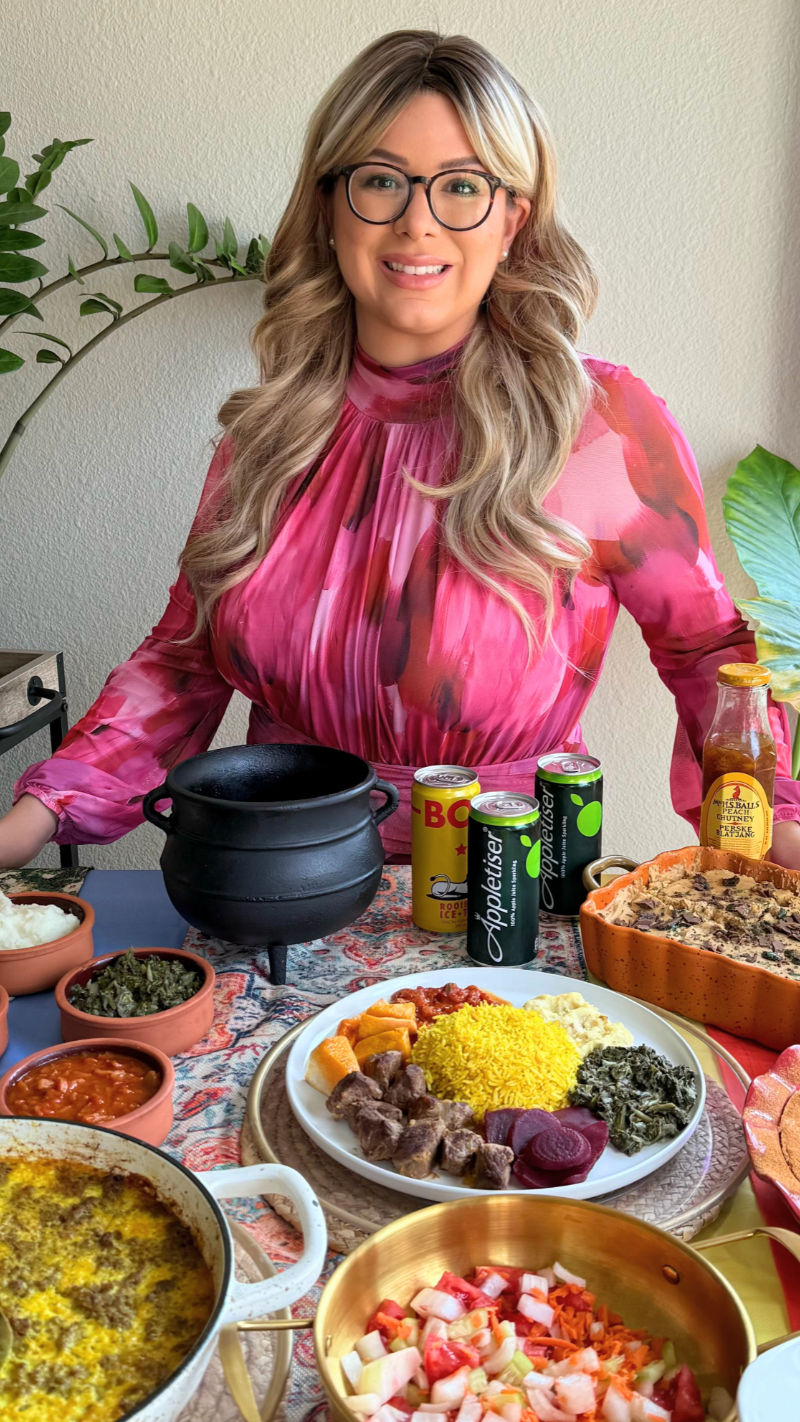 Emilia Kim hosting a South African-inspired table filled with traditional South African dishes